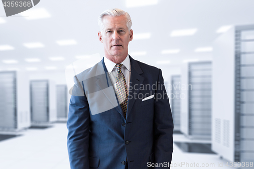 Image of Senior businessman in server room