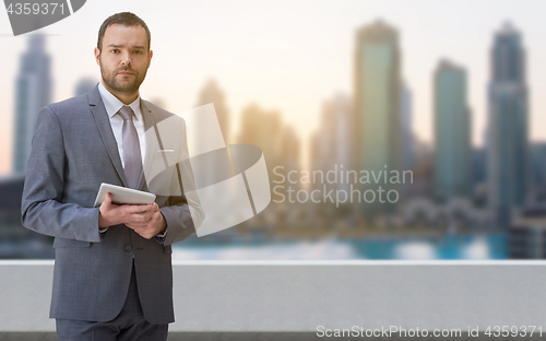 Image of Young businessman in front of the big city