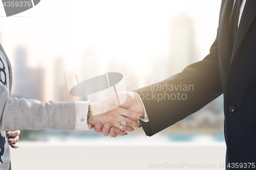 Image of business man and woman handshake on  meeting