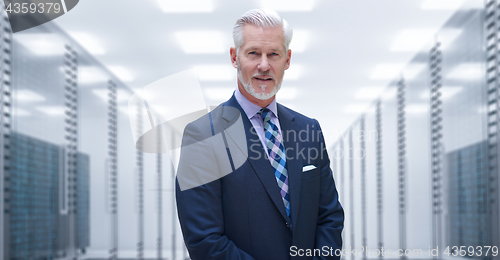 Image of Senior businessman in server room