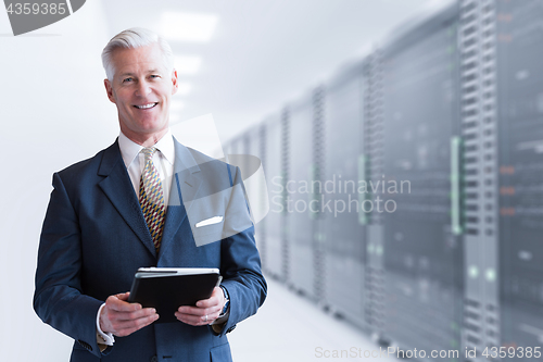 Image of Senior businessman in server room