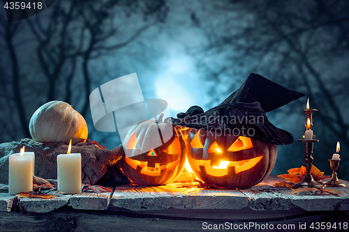 Image of Halloween pumpkins on blue background