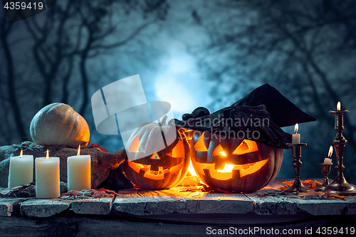 Image of Halloween pumpkins on blue background