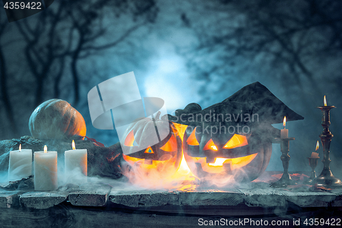 Image of Halloween pumpkins on blue background