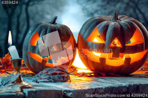 Image of Halloween pumpkins on blue background