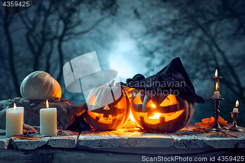 Image of Halloween pumpkins on blue background