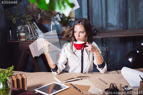 Image of Portrait of a businesswoman who is working at office