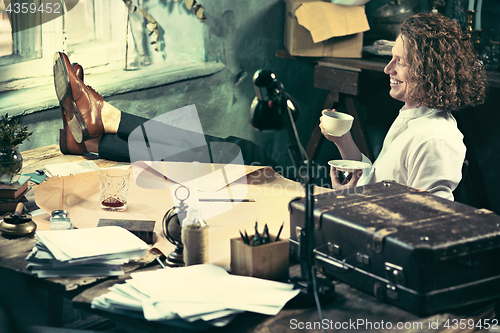 Image of Architect working on drawing table in office