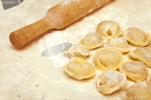 Image of rolling pin and ravioli on table