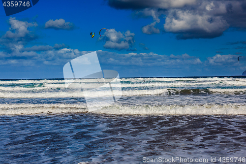 Image of Surfers and kiters in the water on Famara beach, Lanzarote