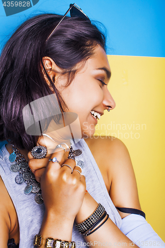 Image of lifestyle people concept. young pretty smiling indian girl with long nails wearing lot of jewelry rings, asian summer happy cool