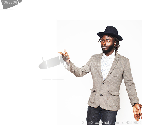 Image of young handsome afro american boy in stylish hipster hat gesturin