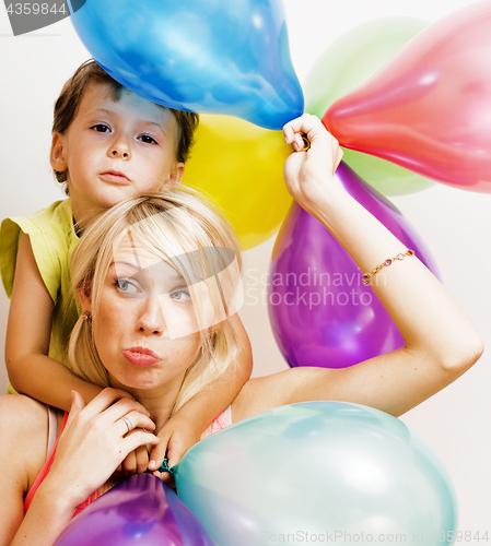 Image of pretty real family with color balloons on white background, blon