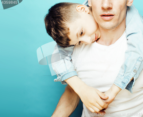 Image of young pretty man model with little cute son playing together, lifestyle modern people concept, family male 