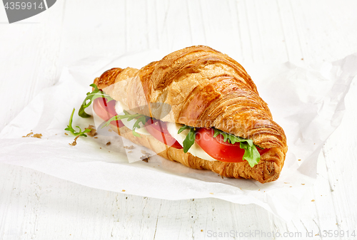 Image of croissant sandwich with tomato and mozzarella