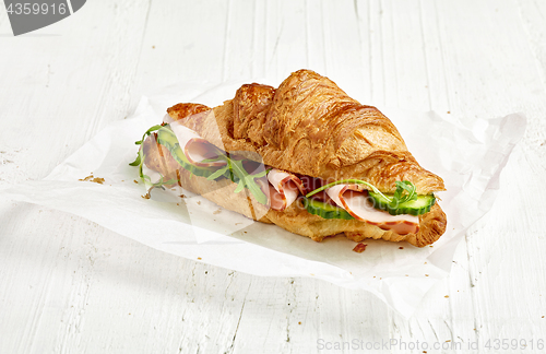 Image of croissant sandwich with ham and cucumber