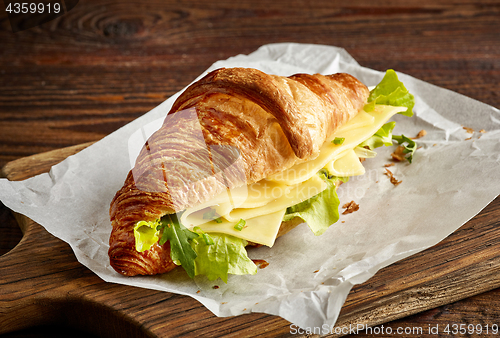 Image of Croissant sandwich with cheese and salad