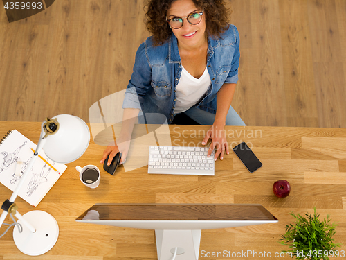 Image of Businesswoman working at the office