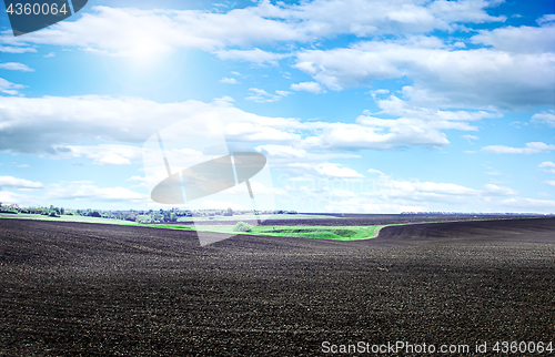 Image of Plowed field on a bright sunny day