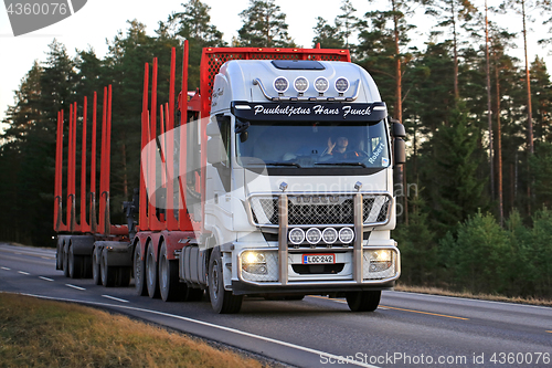 Image of White Iveco Stralis Logging Truck in Evening Light