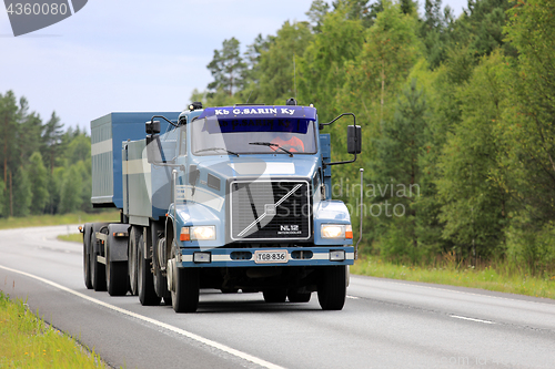 Image of Blue Volvo NL12 Gravel Transport Truck on Road