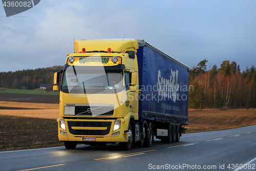 Image of Yellow Volvo FH Transport in Evening