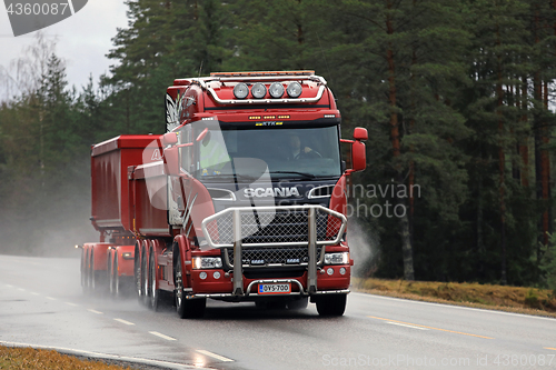 Image of Red Scania Trucking on Wet Road