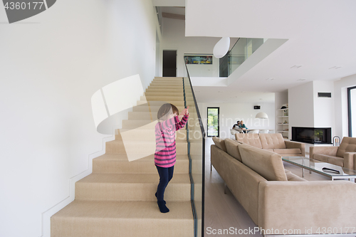 Image of family with little girl enjoys in the modern living room