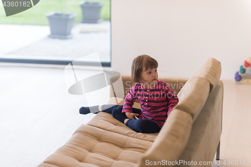 Image of little girl playing games on smartphone