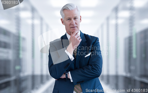 Image of Senior businessman in server room