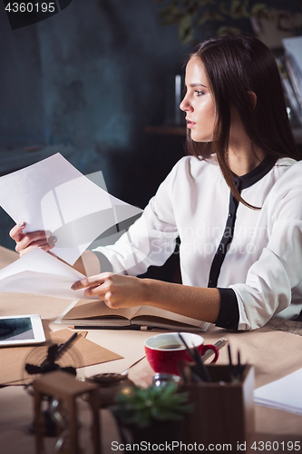 Image of Portrait of a businesswoman who is working at office