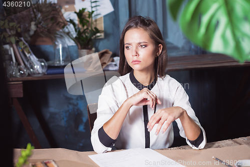 Image of Portrait of a businesswoman who is working at office