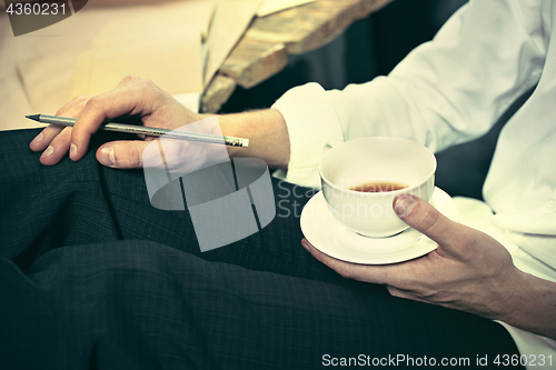 Image of Architect working on drawing table in office