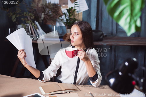 Image of Portrait of a businesswoman who is working at office