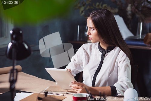 Image of Portrait of a businesswoman who is working at office