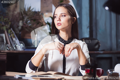 Image of Portrait of a businesswoman who is working at office