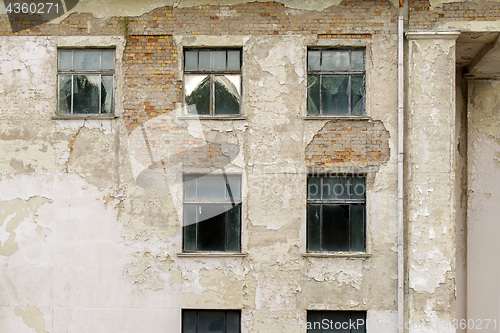Image of abandoned grunge cracked stucco wall