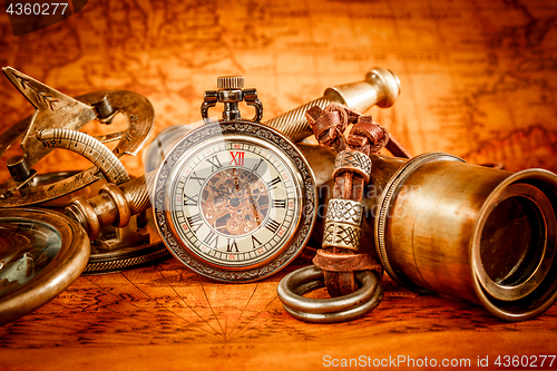 Image of Vintage still life. Vintage items on ancient map.