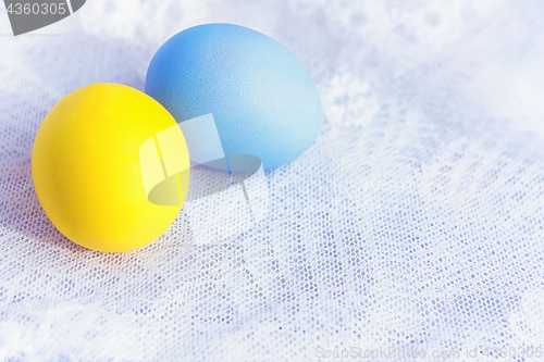 Image of Two Painted Eggs On A Lace