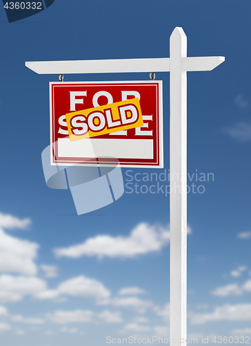 Image of Left Facing Sold For Sale Real Estate Sign on a Blue Sky with Cl