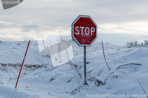 Image of Snow covered stop sign