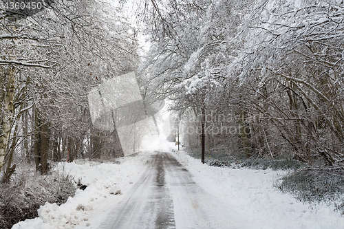 Image of Snowy narrow country road