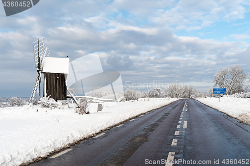 Image of Old windmill by roadside