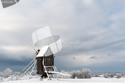 Image of Old windmill in a snowy landscape