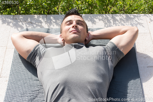 Image of man doing morning yoga exercises