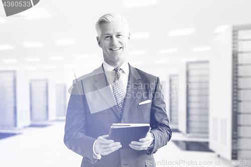 Image of Senior businessman in server room