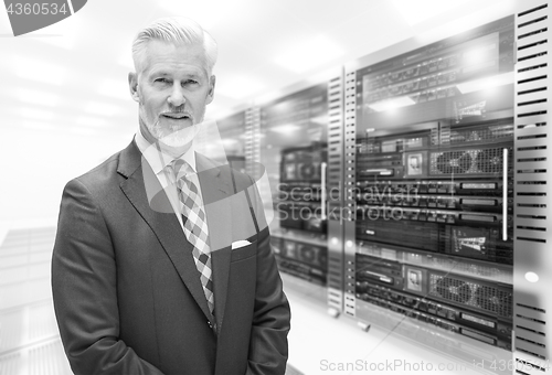 Image of Senior businessman in server room