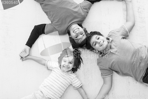 Image of young boys having fun on the floor