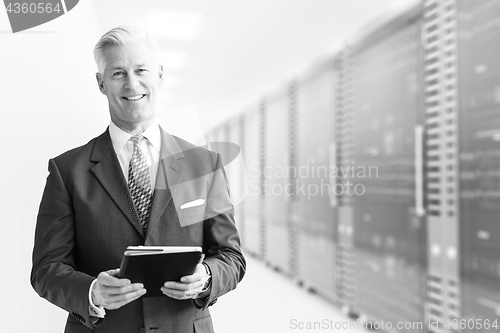 Image of Senior businessman in server room