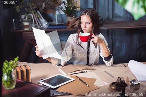 Image of Portrait of a businesswoman who is working at office